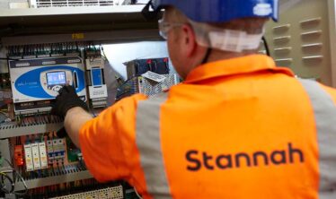Stannah factory worker working on a stairlift rail