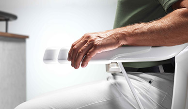 Adjustable armrests on Stannah Solus