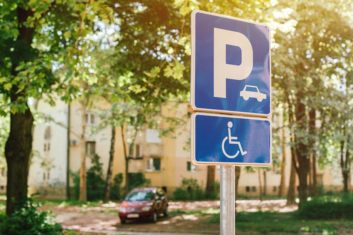 Parking spot sign space for people mobility issues and promote universal accessibility