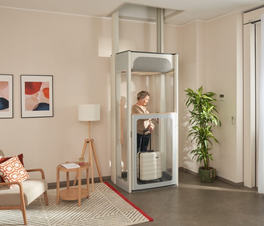 Middle age woman on her Stannah Uplifts S2 homelift.